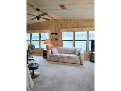 Spacious two-bedroom, two-bath home located in the gated golf on Lake Fairways Country Club in Florida - for sale on GolfHomes.com, golf home, golf lot