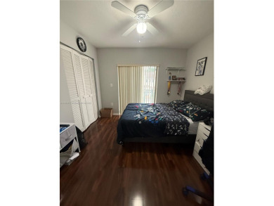 This property is a two-story unit with 3 bed 2.5 bath located in on Country Club of Miami in Florida - for sale on GolfHomes.com, golf home, golf lot