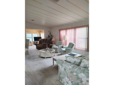 Spacious two-bedroom, two-bath home located in the gated golf on Lake Fairways Country Club in Florida - for sale on GolfHomes.com, golf home, golf lot