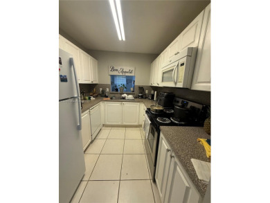 This property is a two-story unit with 3 bed 2.5 bath located in on Country Club of Miami in Florida - for sale on GolfHomes.com, golf home, golf lot