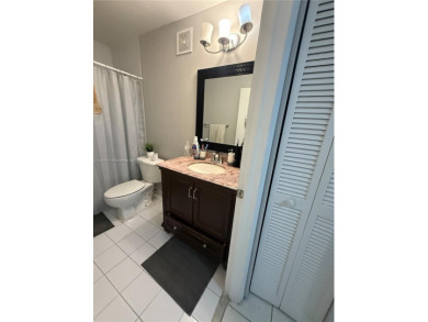 This property is a two-story unit with 3 bed 2.5 bath located in on Country Club of Miami in Florida - for sale on GolfHomes.com, golf home, golf lot