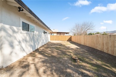 This stunning 3-bedroom, 2-bathroom home in West Banning offers on Sun Lakes Country Club in California - for sale on GolfHomes.com, golf home, golf lot