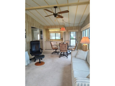 Spacious two-bedroom, two-bath home located in the gated golf on Lake Fairways Country Club in Florida - for sale on GolfHomes.com, golf home, golf lot