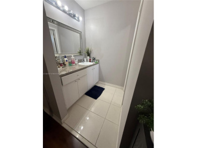 This property is a two-story unit with 3 bed 2.5 bath located in on Country Club of Miami in Florida - for sale on GolfHomes.com, golf home, golf lot