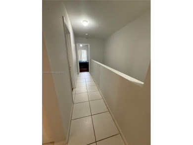 This property is a two-story unit with 3 bed 2.5 bath located in on Country Club of Miami in Florida - for sale on GolfHomes.com, golf home, golf lot