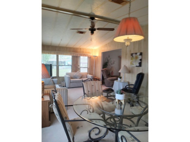 Spacious two-bedroom, two-bath home located in the gated golf on Lake Fairways Country Club in Florida - for sale on GolfHomes.com, golf home, golf lot