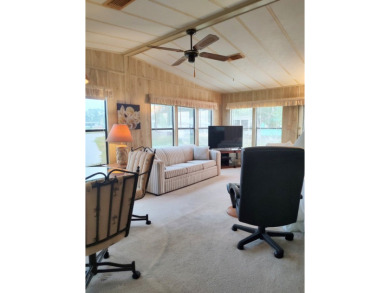 Spacious two-bedroom, two-bath home located in the gated golf on Lake Fairways Country Club in Florida - for sale on GolfHomes.com, golf home, golf lot