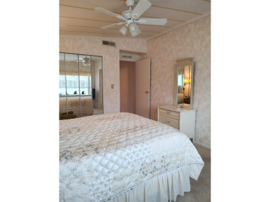 Spacious two-bedroom, two-bath home located in the gated golf on Lake Fairways Country Club in Florida - for sale on GolfHomes.com, golf home, golf lot