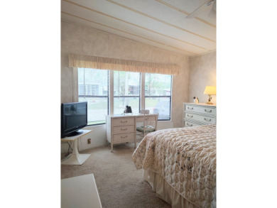 Spacious two-bedroom, two-bath home located in the gated golf on Lake Fairways Country Club in Florida - for sale on GolfHomes.com, golf home, golf lot