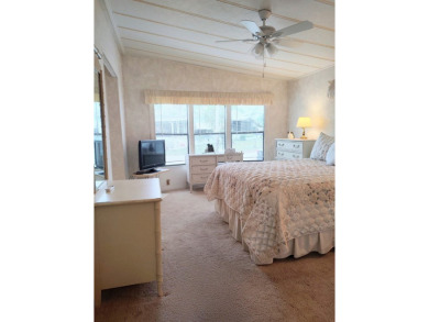 Spacious two-bedroom, two-bath home located in the gated golf on Lake Fairways Country Club in Florida - for sale on GolfHomes.com, golf home, golf lot