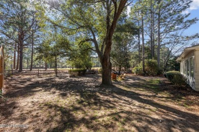Beautifully maintained all brick ranch home nestled in the heart on Whispering Pines Golf Course in North Carolina - for sale on GolfHomes.com, golf home, golf lot