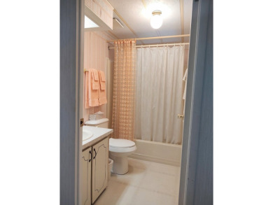 Spacious two-bedroom, two-bath home located in the gated golf on Lake Fairways Country Club in Florida - for sale on GolfHomes.com, golf home, golf lot