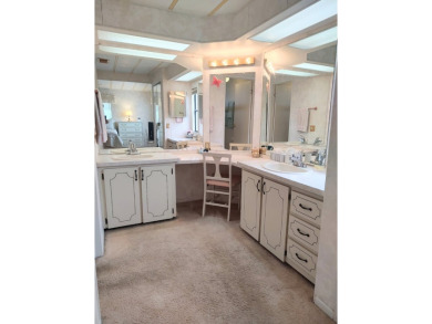 Spacious two-bedroom, two-bath home located in the gated golf on Lake Fairways Country Club in Florida - for sale on GolfHomes.com, golf home, golf lot