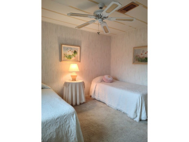 Spacious two-bedroom, two-bath home located in the gated golf on Lake Fairways Country Club in Florida - for sale on GolfHomes.com, golf home, golf lot