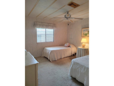 Spacious two-bedroom, two-bath home located in the gated golf on Lake Fairways Country Club in Florida - for sale on GolfHomes.com, golf home, golf lot