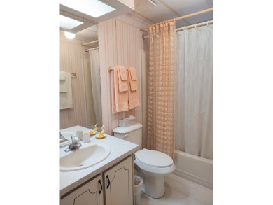 Spacious two-bedroom, two-bath home located in the gated golf on Lake Fairways Country Club in Florida - for sale on GolfHomes.com, golf home, golf lot
