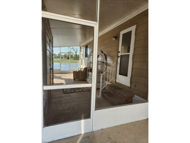 Spacious two-bedroom, two-bath home located in the gated golf on Lake Fairways Country Club in Florida - for sale on GolfHomes.com, golf home, golf lot