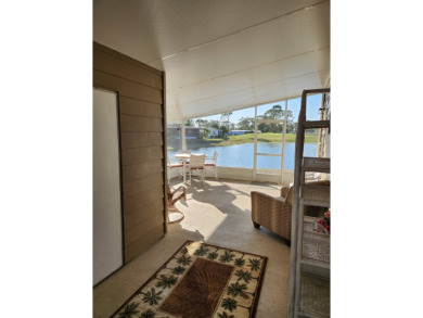 Spacious two-bedroom, two-bath home located in the gated golf on Lake Fairways Country Club in Florida - for sale on GolfHomes.com, golf home, golf lot