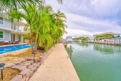 Fantastic 6 Bedroom, 4 Bath 3,248 sq. ft. waterfront pool home on Key Colony Beach Golf Course in Florida - for sale on GolfHomes.com, golf home, golf lot