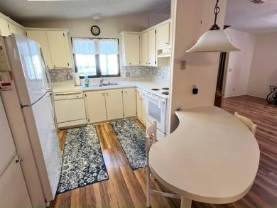 PRICE REDUCTION! Well-cared for 2-bd 2-ba home, located on a on Del Tura Golf and Country Club in Florida - for sale on GolfHomes.com, golf home, golf lot