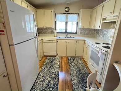 PRICE REDUCTION! Well-cared for 2-bd 2-ba home, located on a on Del Tura Golf and Country Club in Florida - for sale on GolfHomes.com, golf home, golf lot