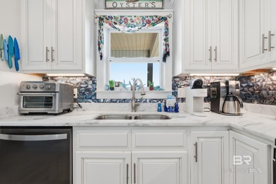 TURN-KEY coastal living with breathtaking water views from every on Isle Dauphine Club Golf Course in Alabama - for sale on GolfHomes.com, golf home, golf lot