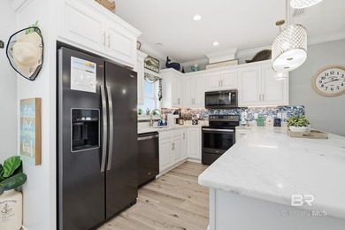 TURN-KEY coastal living with breathtaking water views from every on Isle Dauphine Club Golf Course in Alabama - for sale on GolfHomes.com, golf home, golf lot