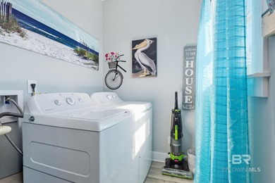 TURN-KEY coastal living with breathtaking water views from every on Isle Dauphine Club Golf Course in Alabama - for sale on GolfHomes.com, golf home, golf lot