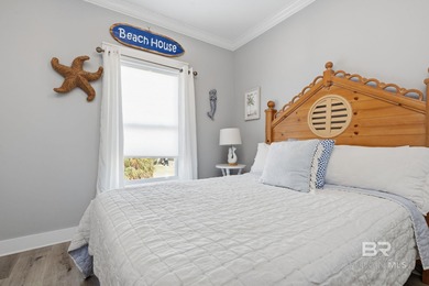 TURN-KEY coastal living with breathtaking water views from every on Isle Dauphine Club Golf Course in Alabama - for sale on GolfHomes.com, golf home, golf lot