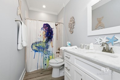 TURN-KEY coastal living with breathtaking water views from every on Isle Dauphine Club Golf Course in Alabama - for sale on GolfHomes.com, golf home, golf lot