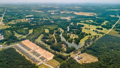 This homesite features a private lot with wooded buffer on Santee National Golf Course in South Carolina - for sale on GolfHomes.com, golf home, golf lot
