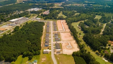 This homesite features a private lot with wooded buffer on Santee National Golf Course in South Carolina - for sale on GolfHomes.com, golf home, golf lot