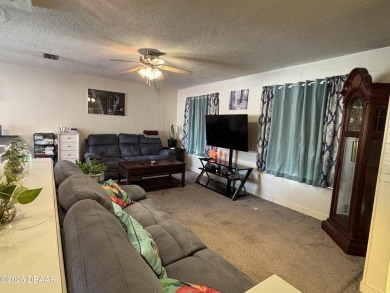 Experience Florida living with a tranquil setting in this on Daytona Beach Golf Club in Florida - for sale on GolfHomes.com, golf home, golf lot