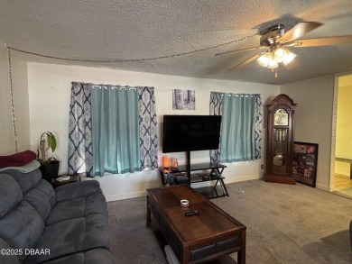 Experience Florida living with a tranquil setting in this on Daytona Beach Golf Club in Florida - for sale on GolfHomes.com, golf home, golf lot