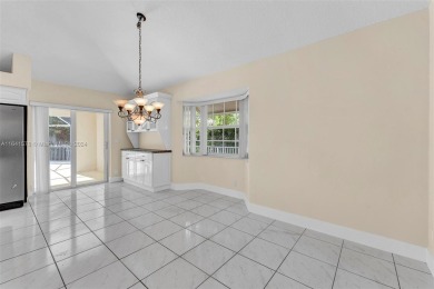 Welcome to this beautifully updated 4-bedroom, 2.5-bathroom pool on TPC Eagle Trace in Florida - for sale on GolfHomes.com, golf home, golf lot