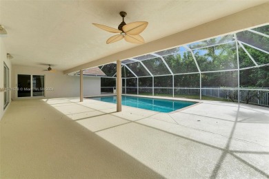 Welcome to this beautifully updated 4-bedroom, 2.5-bathroom pool on TPC Eagle Trace in Florida - for sale on GolfHomes.com, golf home, golf lot