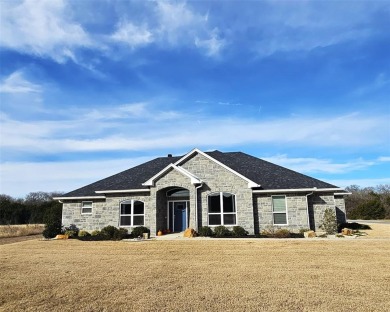 Discover this stunning 2022 custom-built home nestled in the on White Bluff Resort - New Course in Texas - for sale on GolfHomes.com, golf home, golf lot