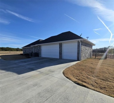 Discover this stunning 2022 custom-built home nestled in the on White Bluff Resort - New Course in Texas - for sale on GolfHomes.com, golf home, golf lot