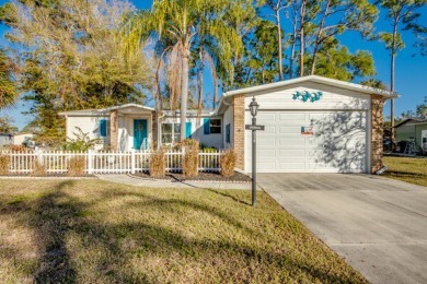 This stunning two-bedroom, two-bathroom home is ready for you to on Pine Lakes Country Club in Florida - for sale on GolfHomes.com, golf home, golf lot