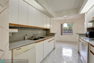SALE OF THE CENTURY IN VIBRANT & HIGHLY SOUGHT AFTER WYNMOOR! on Wynmoor Golf Course in Florida - for sale on GolfHomes.com, golf home, golf lot