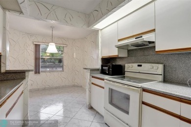 SALE OF THE CENTURY IN VIBRANT & HIGHLY SOUGHT AFTER WYNMOOR! on Wynmoor Golf Course in Florida - for sale on GolfHomes.com, golf home, golf lot