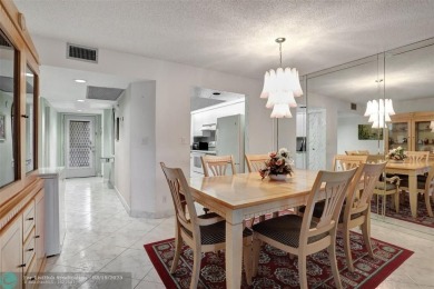 SALE OF THE CENTURY IN VIBRANT & HIGHLY SOUGHT AFTER WYNMOOR! on Wynmoor Golf Course in Florida - for sale on GolfHomes.com, golf home, golf lot