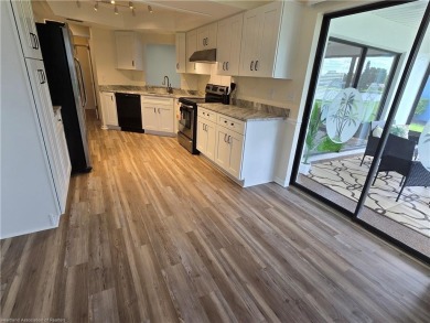 BEAUTIFULLY REMODELED! WONDERFUL LAKE VIEWS! Set in the popular on Golf Hammock Country Club in Florida - for sale on GolfHomes.com, golf home, golf lot