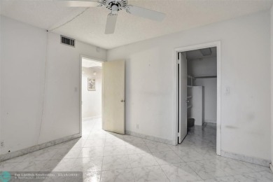 SALE OF THE CENTURY IN VIBRANT & HIGHLY SOUGHT AFTER WYNMOOR! on Wynmoor Golf Course in Florida - for sale on GolfHomes.com, golf home, golf lot