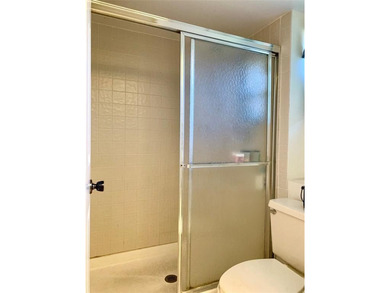 Great second floor 2 bedroom, 2 bath condo with large patio on Deer Creek Golf Club in Florida - for sale on GolfHomes.com, golf home, golf lot