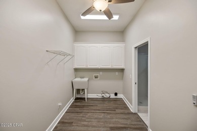 This spacious and stately 3 bedroom 2.5 bath townhome offers the on Panama Country Club in Florida - for sale on GolfHomes.com, golf home, golf lot