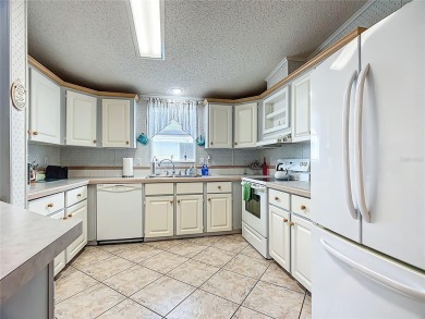 Step inside and feel at home instantly in this beautifully on Lily Lake Golf and RV Resort in Florida - for sale on GolfHomes.com, golf home, golf lot