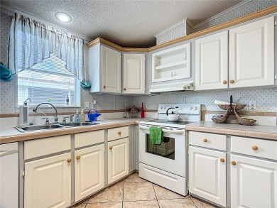 Step inside and feel at home instantly in this beautifully on Lily Lake Golf and RV Resort in Florida - for sale on GolfHomes.com, golf home, golf lot