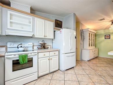 Step inside and feel at home instantly in this beautifully on Lily Lake Golf and RV Resort in Florida - for sale on GolfHomes.com, golf home, golf lot