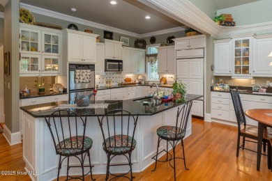 Experience elegant living in this stunning golf front home on Pinewild Country Club of Pinehurst in North Carolina - for sale on GolfHomes.com, golf home, golf lot